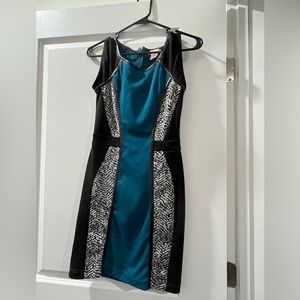 Body central dress- fits tight it has stretch, very cute. Has back zipper. Small